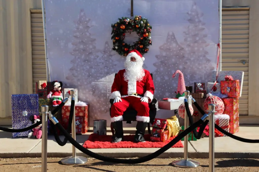 A Santa Claus Sitting on a Wooden Chair