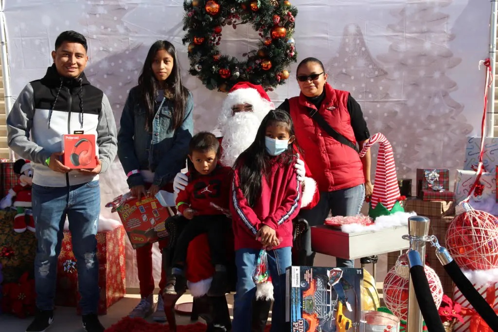 A Group of People Posing With Santa